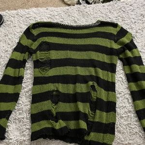 Distressed black and green knitted sweater